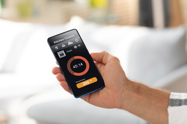 Man holding a smartphone with a home automation app