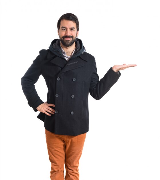 Man holding something over white background