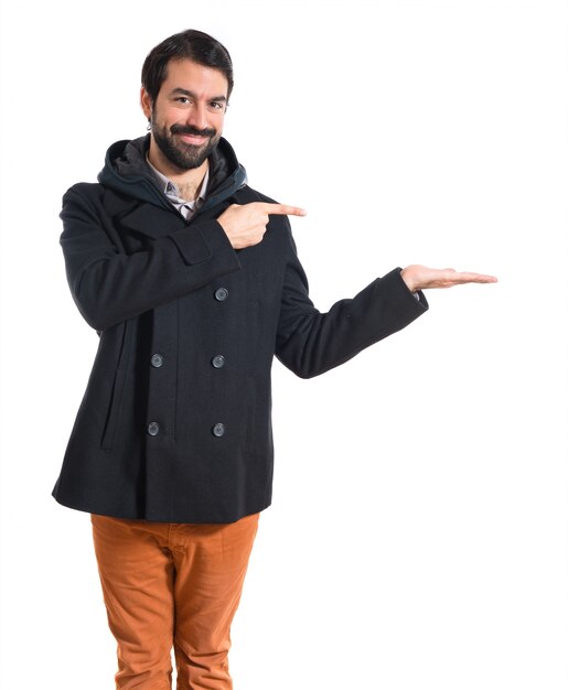 Man holding something over white background