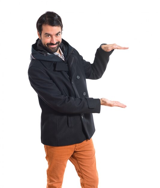 Man holding something over white background