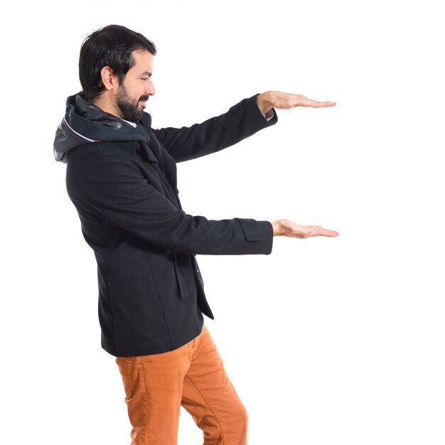 Man holding something over white background