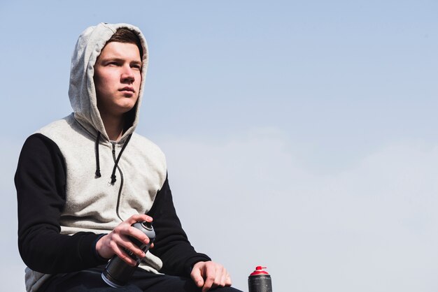 Man holding spray bottle