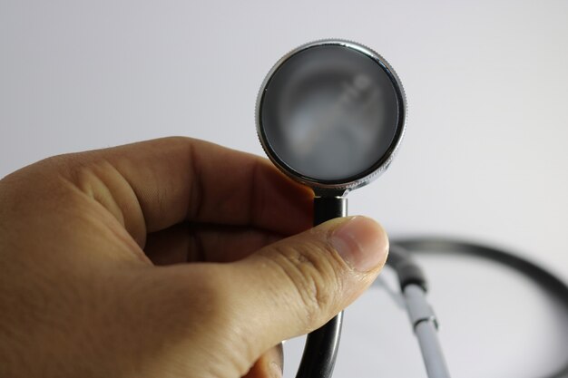 Man holding stethoscope
