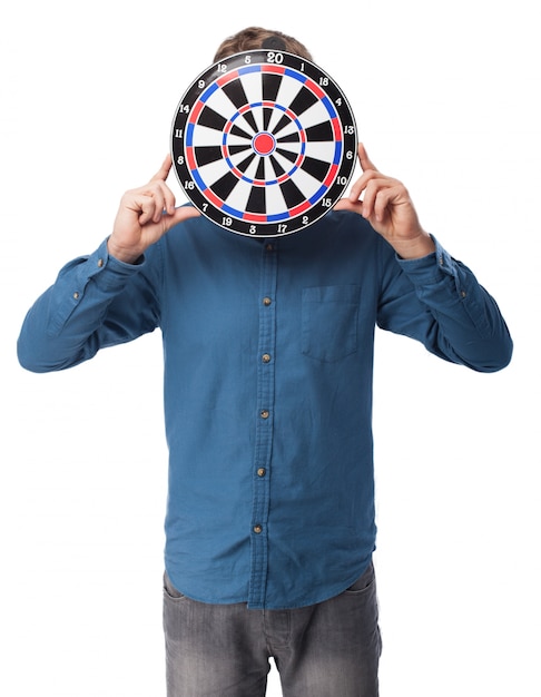 Man holding a target on his face