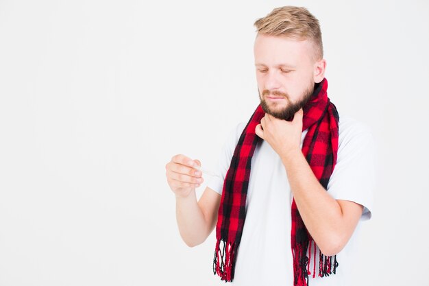 Man holding thermometer 