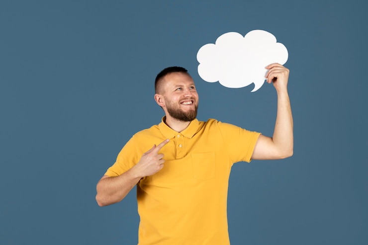 Free Photo man holding a thought bubble