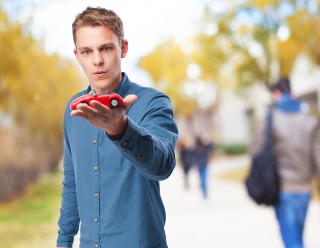 Man holding a toy car