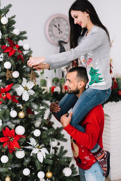 Man holding woman on neck 