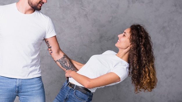 Free photo man holding woman waist with hand