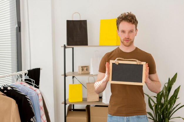 Man holding wooden frame