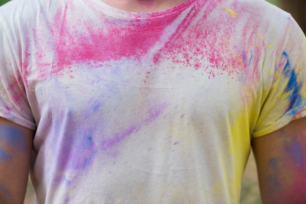 Free photo man holi with colored t-shirt