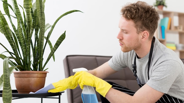 Man at home cleaning