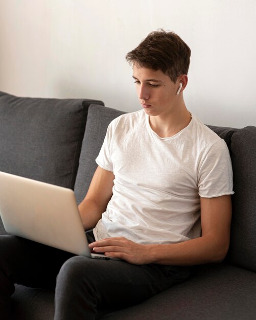 Man at home in quarantine working on laptop