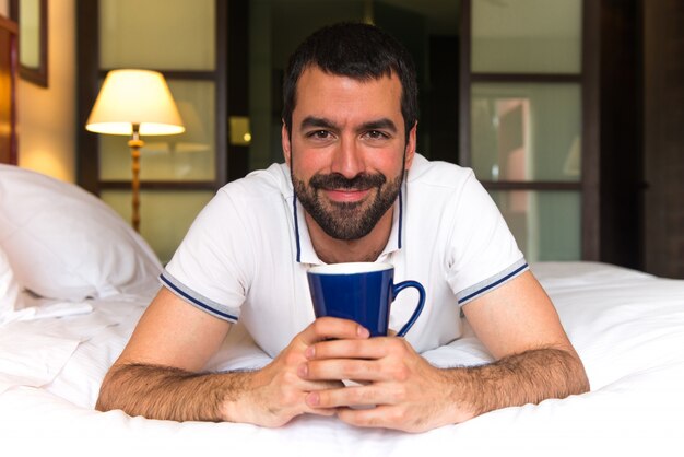 Man in a hotel drinking coffee