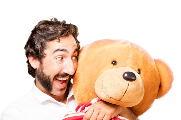 Man hugging a big teddy bear