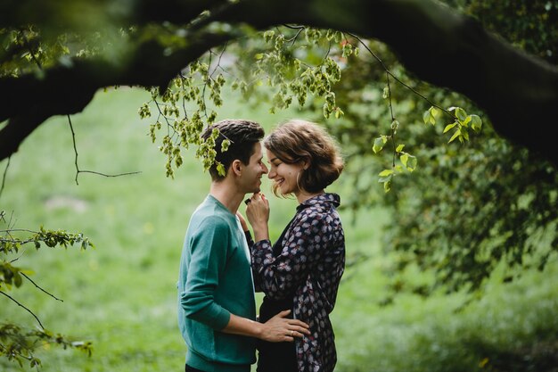 Man hugs his wife and they smile to each other