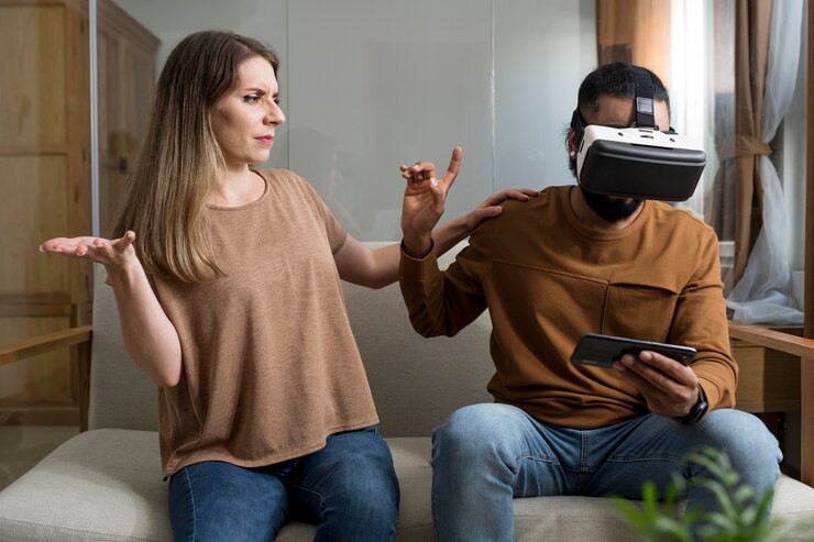 Free Photo man ignoring his girlfriend while playing