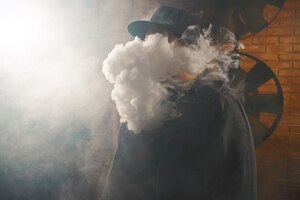man in a cloud of white vapour fume
