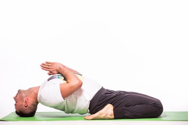 Man is making yoga isolated over white background