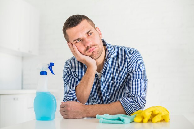 man is tired from cleaning