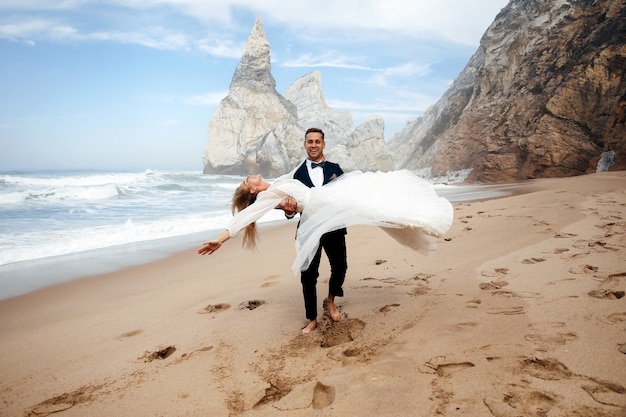 Free photo man is whirling the woman and they look very happiness