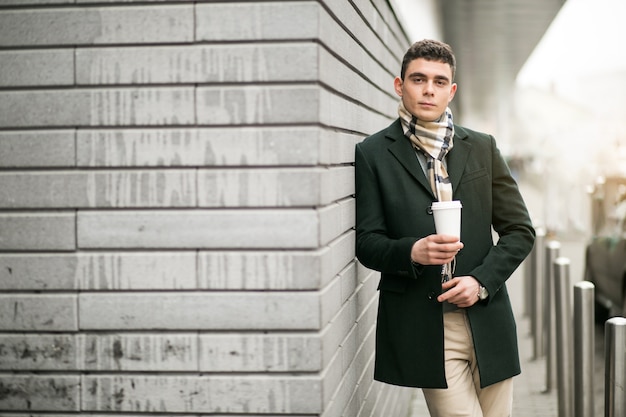 Man in jacket with coffee