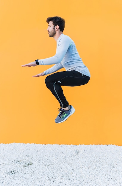 Free photo man jumping during training