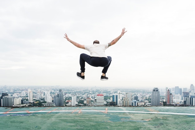 Man jumping on the rooftop