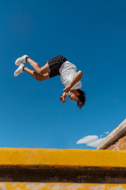 Man jumping while doing parkour