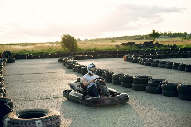 Man in a karting circuit with a car