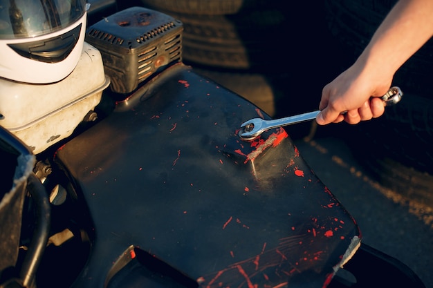 Free photo man in a karting circuit with a car