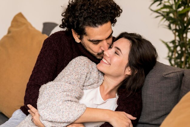 Man kissing his wife on the cheek