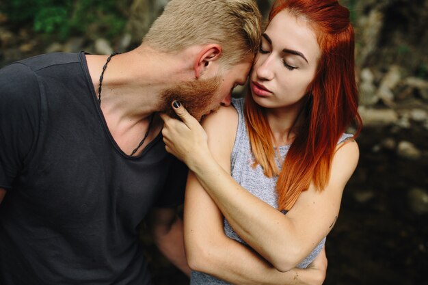 Man kissing his wife's shoulder