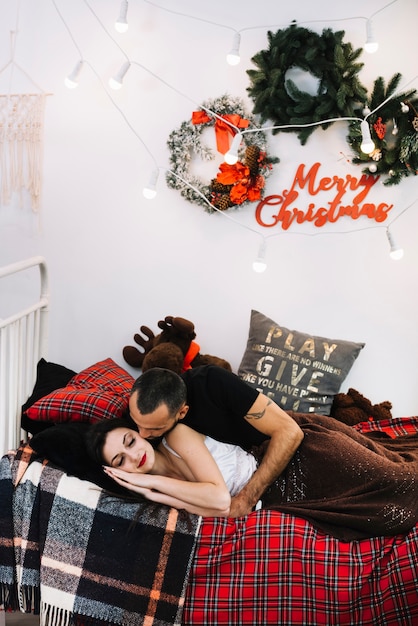 Man kissing sleeping woman 