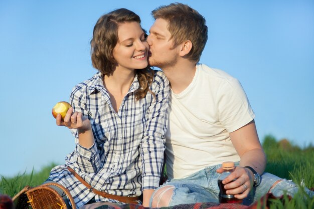 Man kissing woman's face