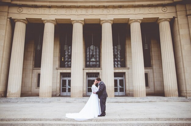 Man kissing woman on their wedding day