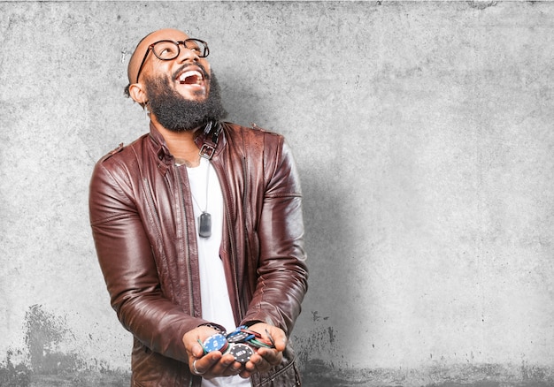 Man laughing with many casino chips