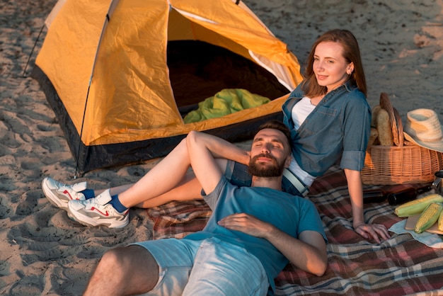 Man laying down on girlfriend lap