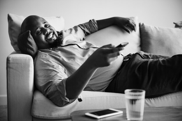 Man laying and relaxing on the couch