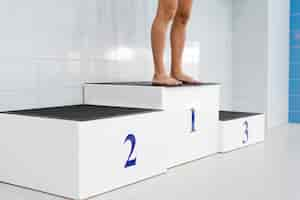 Free photo man legs standing on first position podium