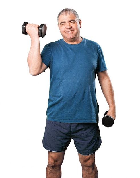 Man lifting black dumbbells while smiling