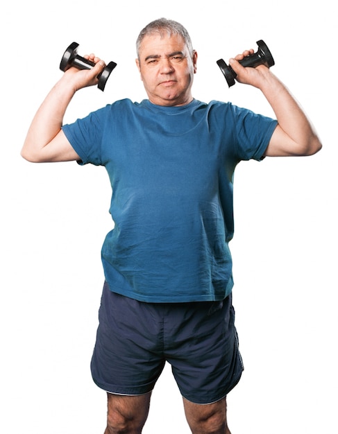 Free photo man lifting black dumbbells