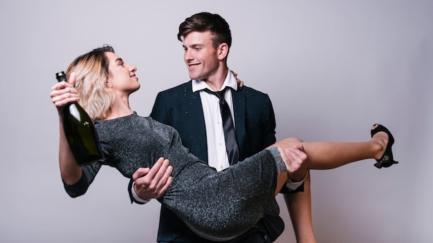 Free photo man lifting woman at party