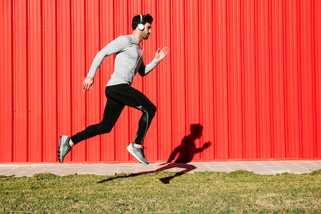 Man listening to music and leaping