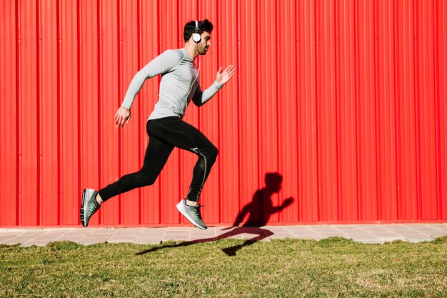 Man listening to music and leaping