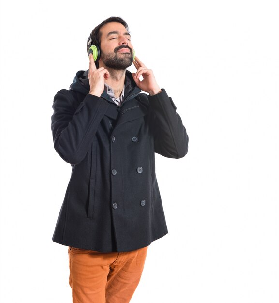 Man listening music over white background