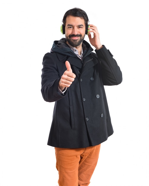 Man listening music over white background