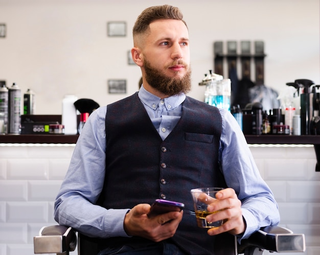 Free photo man looking away at the salon