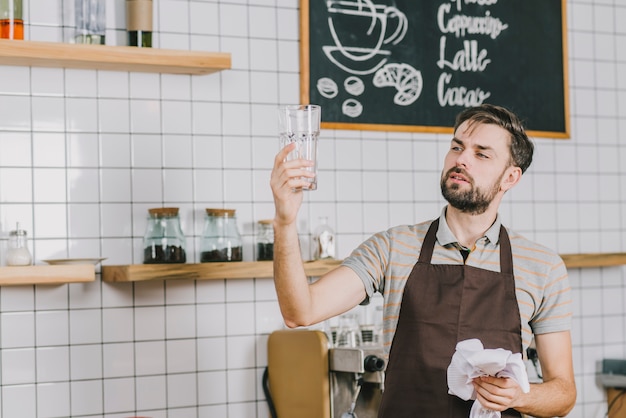 Man looking at clean glass