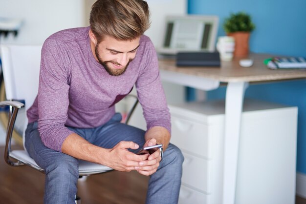 Man looking down on his phone